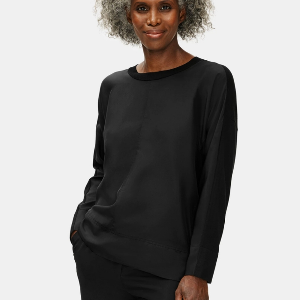 Eileen Fisher S black silk fabric (front) and knit (back) top, long sleeves.